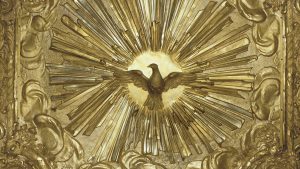 Painel dourado com pomba