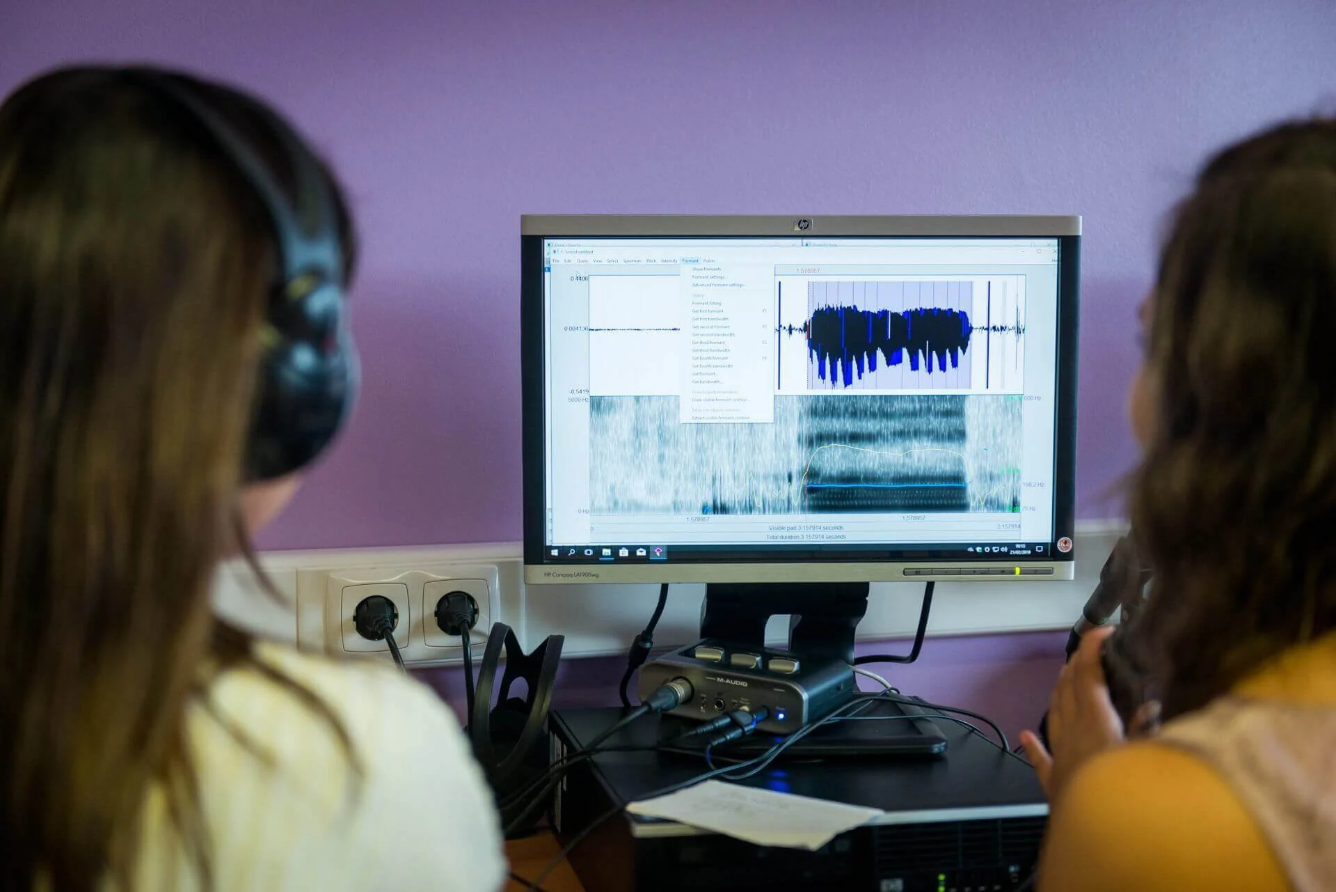 Female students in front of a monitor