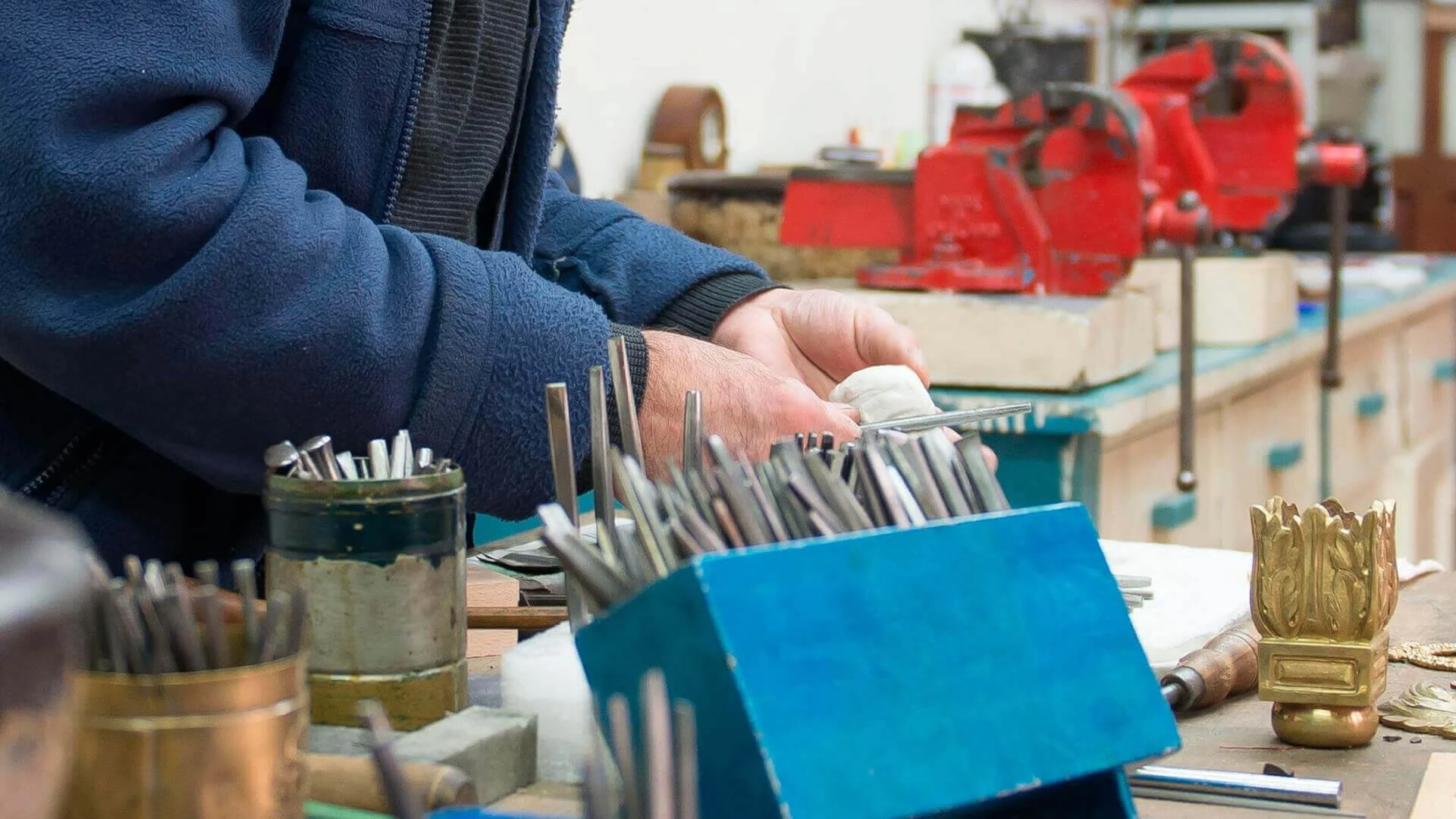 Man cleaning carpentry equipment
